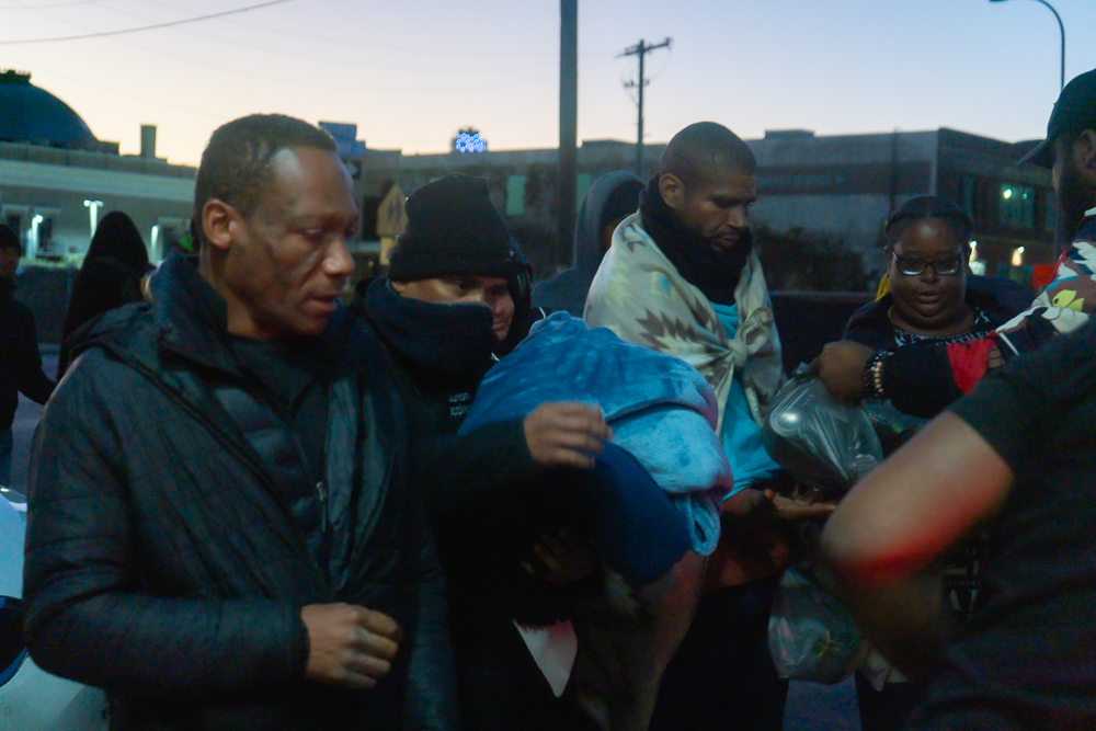 Volunteers assisting families with resources